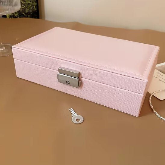 Boite à bijoux rose avec barrure