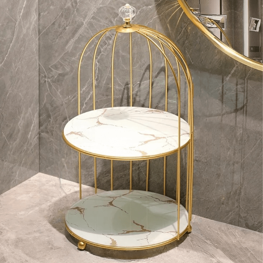 organisateur de maquillage blanc et or en forme de cage oiseaux