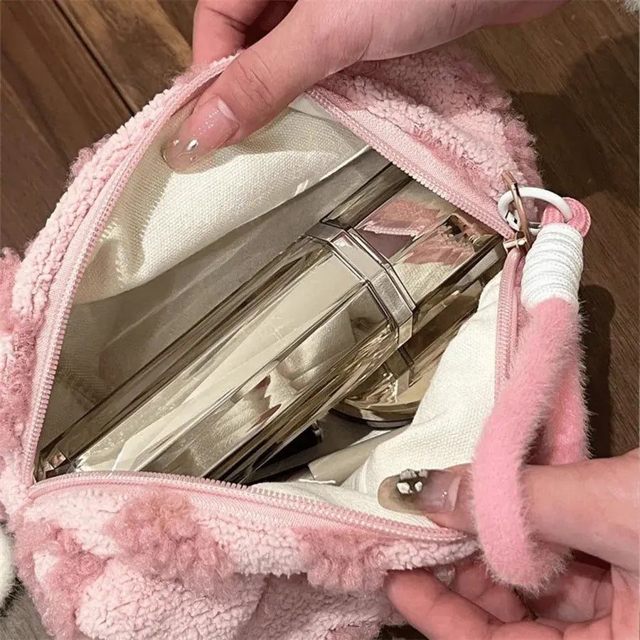 trousse -Ă maquillage rose pĂąle ouverte