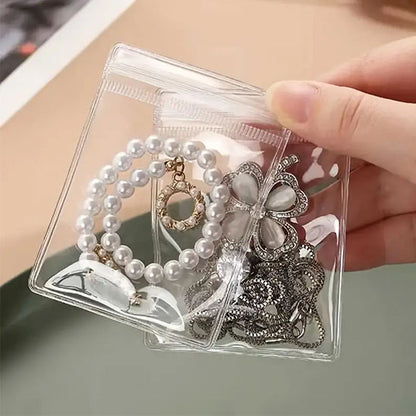 pochette à bijoux transparente avec bijoux intérieur