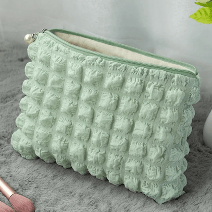 pochette pour maquillage verte gaufrée