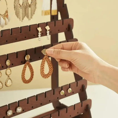 porte boucle d'oreille avec trou pour les pines oreilles