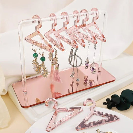 Rangement pour bijoux en forme de cintre rose