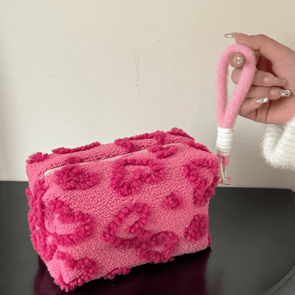 trousse à maquillage rose foncé en peluche