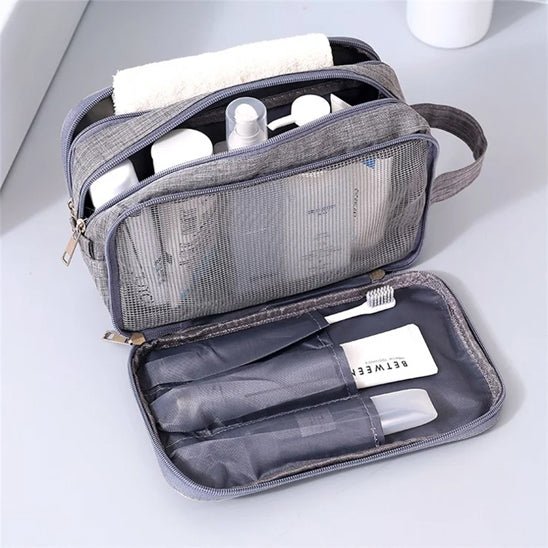 Trousse de toilette avion Compact grise en maille intérieure - La trousse Beauté