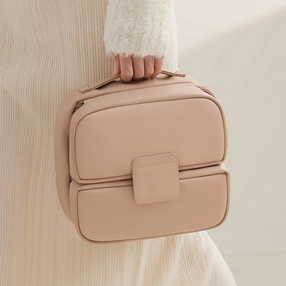 Trousse de toilette femme tendance avec poignée rose en similicuir