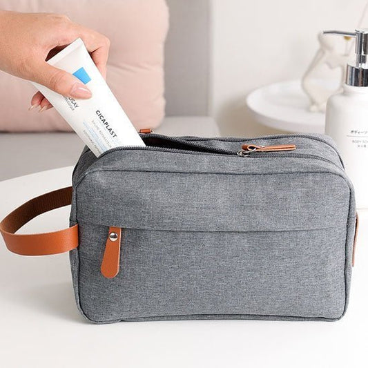 Trousse de toilette gris avec poignée cuir marron