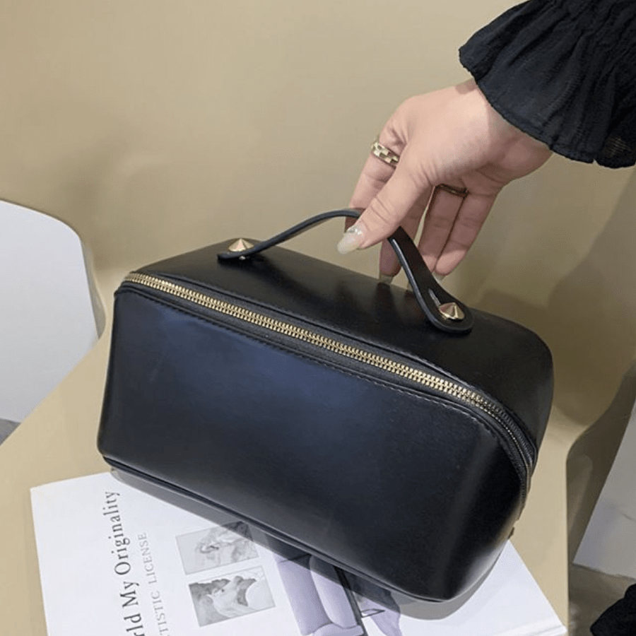 trousse de toilettenoie en cuir et poignée dessus
