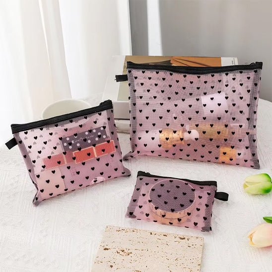 Trousses de maquillage rose transparent avec motif en coeur